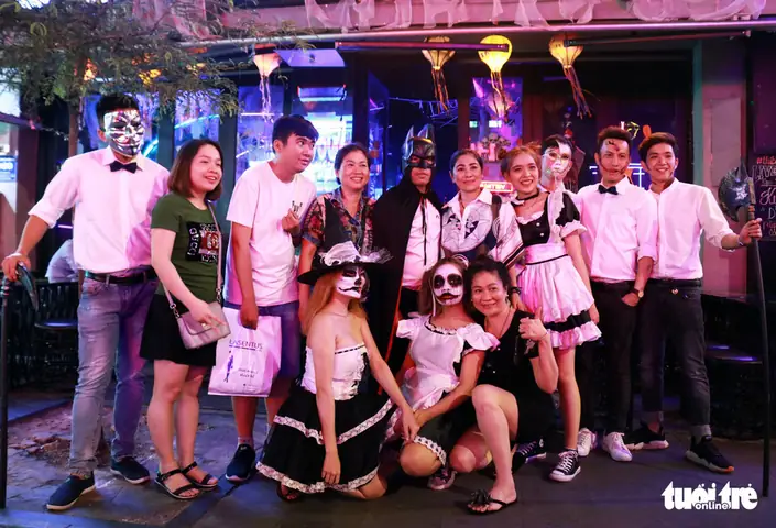 A Group Of Waiters Pose In Their Halloween-themed Make-up In Front Of A Restaurant On Bui Vien Street In District 1, Ho Chi Minh City, October 31, 2019. Photo: Ngoc Phuong / Tuoi Tre
