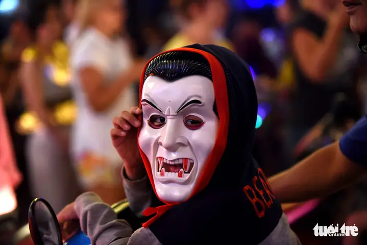A Boy Dons A Vampire Mask On Bui Vien Street In District 1, Ho Chi Minh City, October 31, 2019. Photo: Duyen Phan / Tuoi Tre
