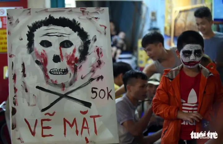 A Board Shows Off Prices For Halloween Themed Face Painting On Bui Vien Street In District 1, Ho Chi Minh City, October 31, 2019. Photo: Duyen Phan / Tuoi Tre