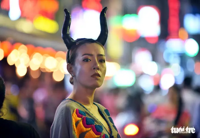 A Woman Makes Her Best Attempt At Recreating Maleficent, A Disney’s Character, On Bui Vien Street In District 1, Ho Chi Minh City, October 31, 2019. Photo: Duyen Phan / Tuoi Tre