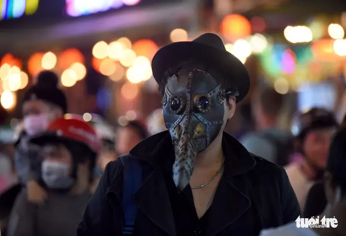 A Masked Man On Bui Vien Street In District 1, Ho Chi Minh City, October 31, 2019. Photo: Duyen Phan / Tuoi Tre