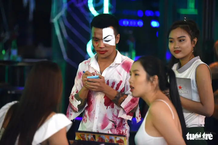 A Restaurant Waiter Wears A Bloodied Shirt And Morbid Make-up On Bui Vien Street In District 1, Ho Chi Minh City, October 31, 2019. Photo: Duyen Phan / Tuoi Tre