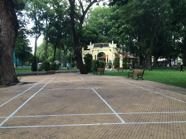 They Had Badminton Courts Drawn Out All Over The Park's Walk Ways. There Were A Few Guys Playing While We Were Walking Around.