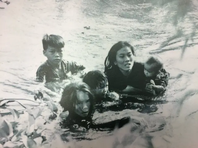 Picture By Kyoichi Sawada Of A Vietnamese Mom Wading Across A River With Her Children To Escape Bombs From A U.s. Air Strike