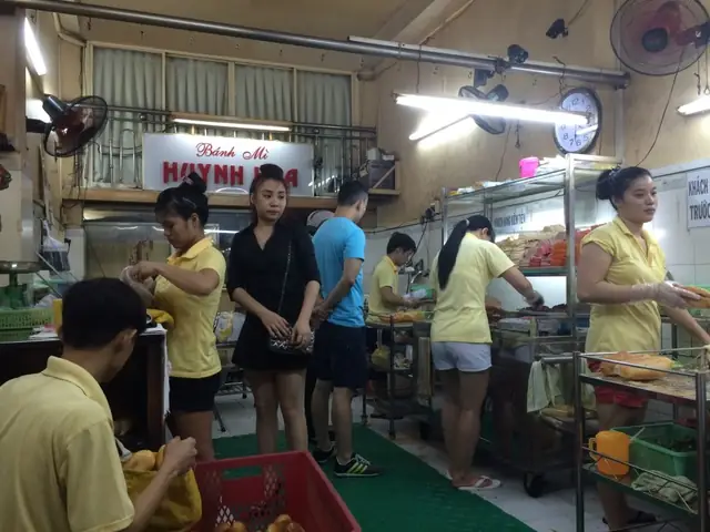 Lots Of Staff Prepping All The Banh Mi Orders